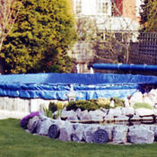 Winter debris cover on round above ground pool