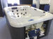 Hot Tub with Grey Cabinet with open panel